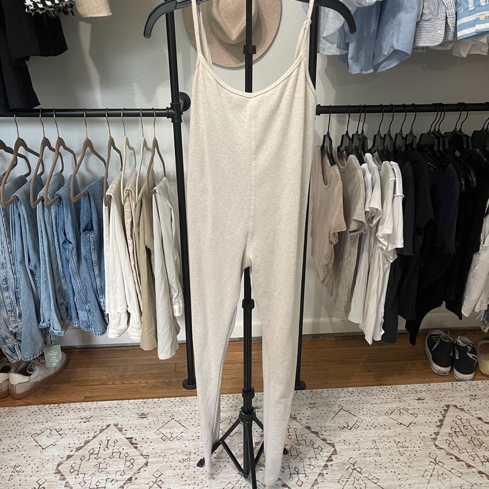 Cream colored onesie / one piece leggings.